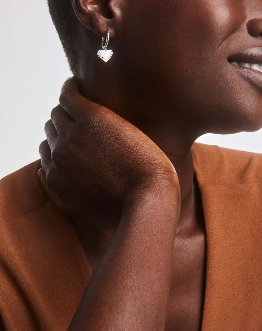 Ari Heart Huggie Earrings in Silver