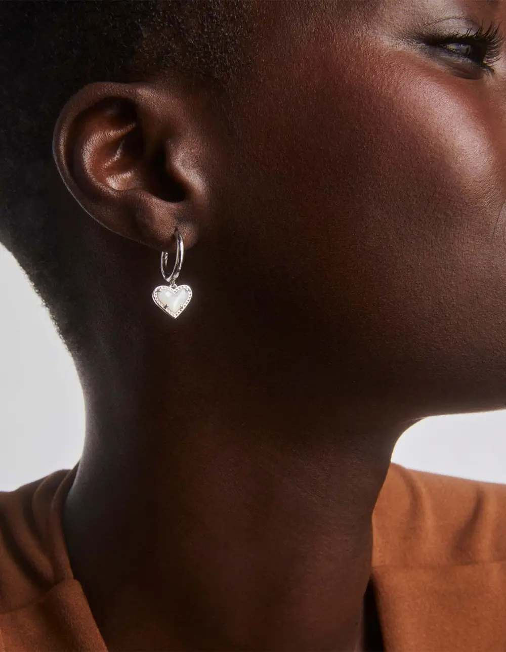 Ari Heart Huggie Earrings in Silver